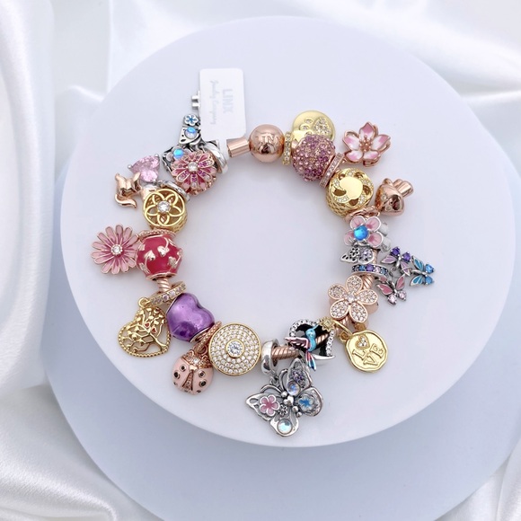 Linx Rose Gold Bracelet with Rose Gold Yellow Gold and Silver Themed Charms